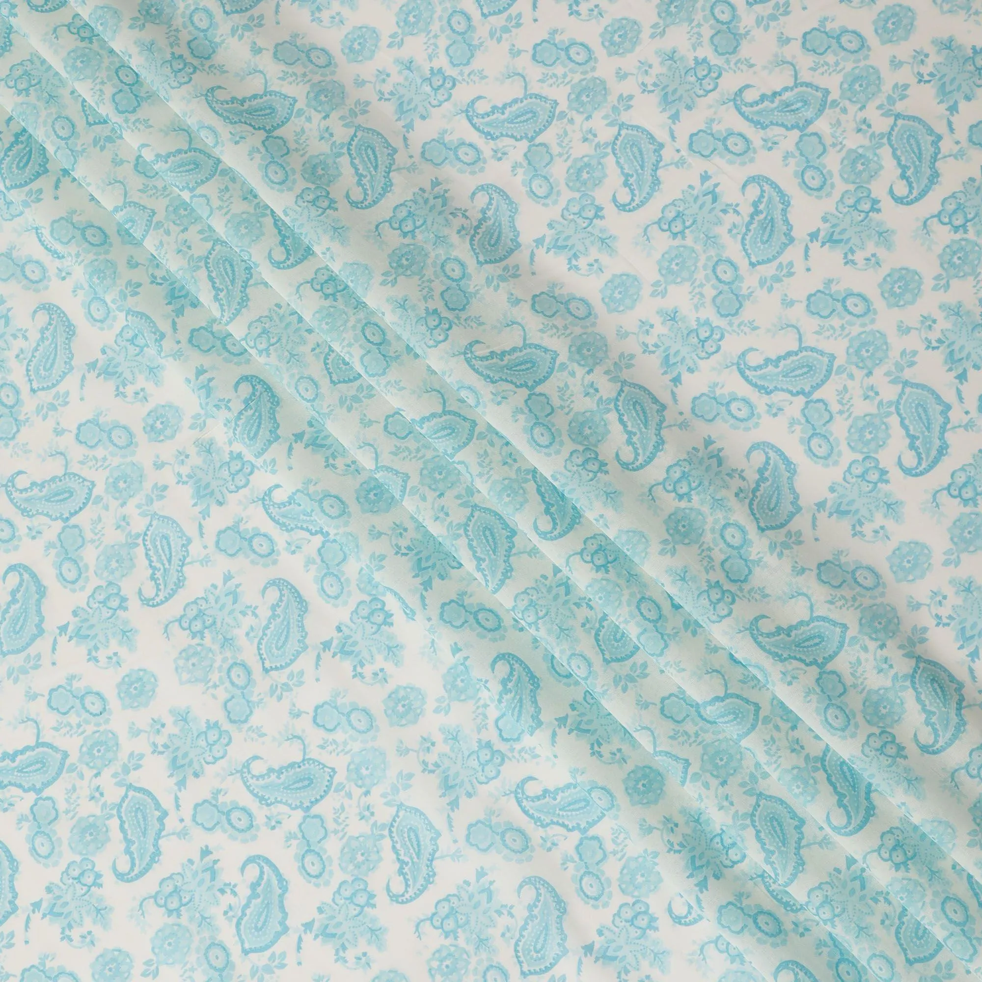 Off white cotton voile fabric with baby blue print in paisley design-D16417